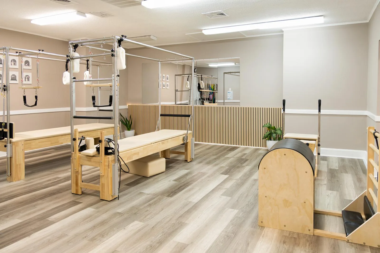 Main Pilates room with Cadillacs, a Ladder Barrel and a Wunda Chair