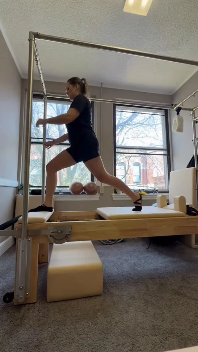Standing exercise on the Reformer during a private Pilates session