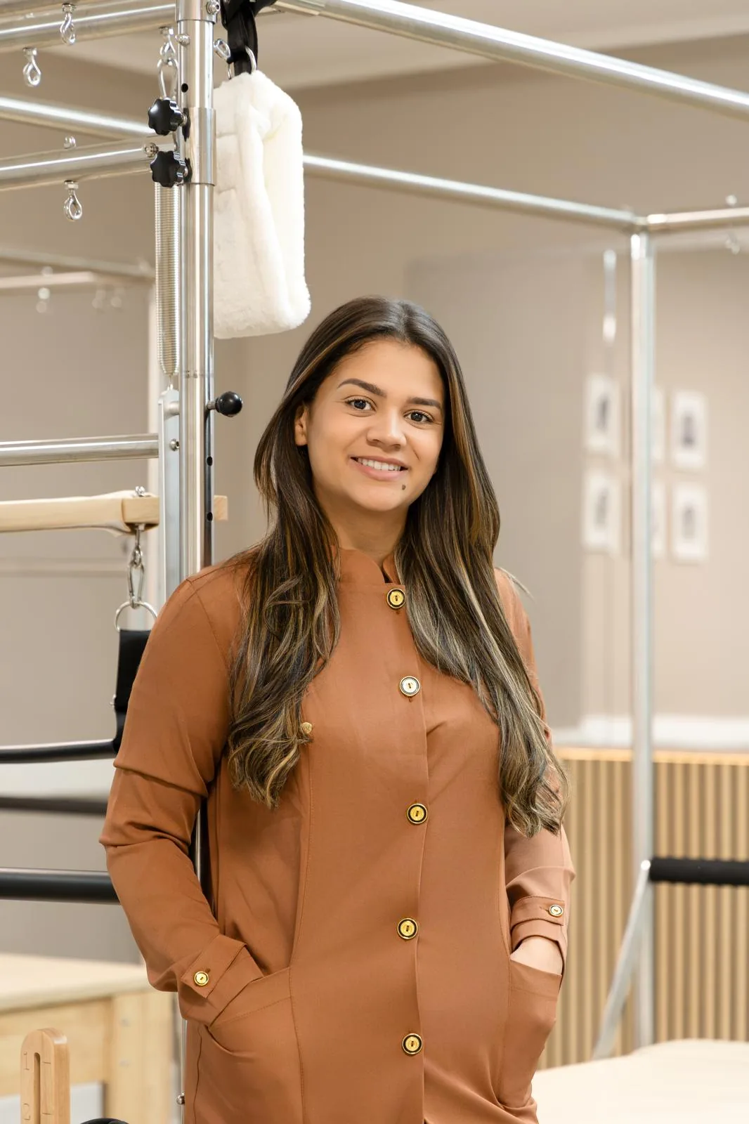 Portrait of Bruna Felix Costa, owner and Pilates instructor at Inspire Pilates Studio